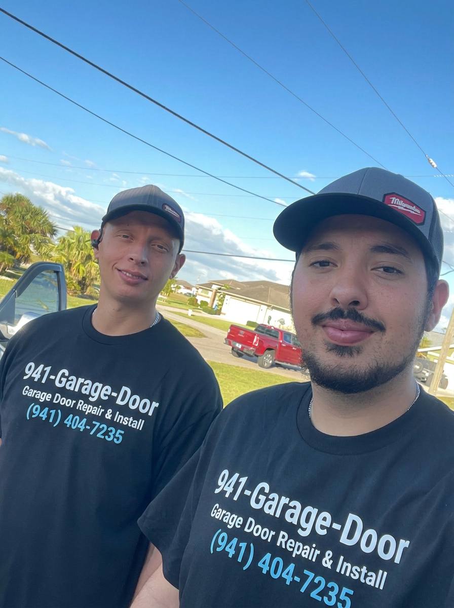Two uniformed 941-Garage-Door technicians on a residential service call in Southwest Florida